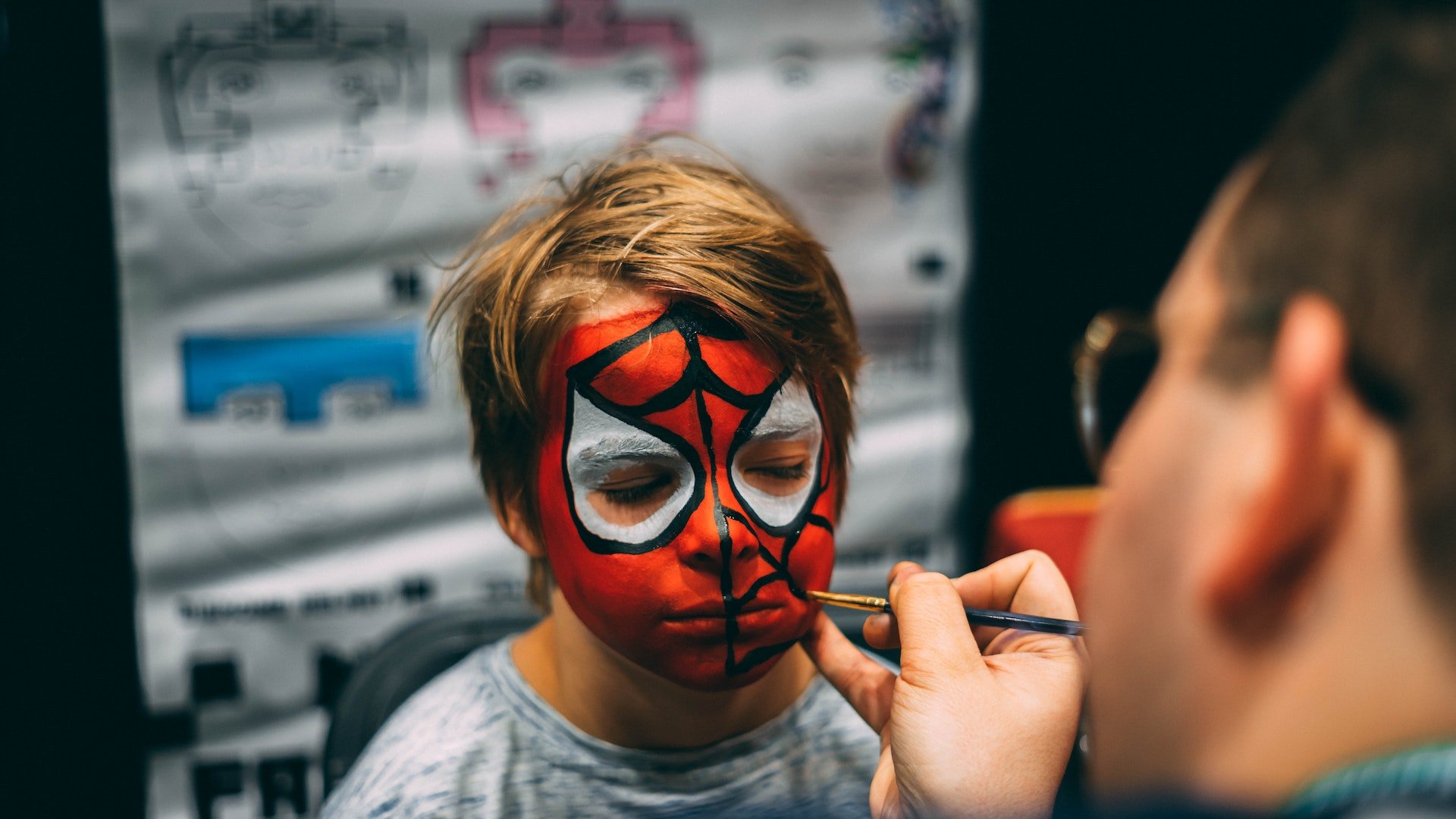 spiderman face painting on kid. Photo credit Kevin Bidwell, Pexels